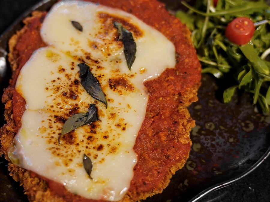 Chicken parm under melted mozzarella and crisped sage
