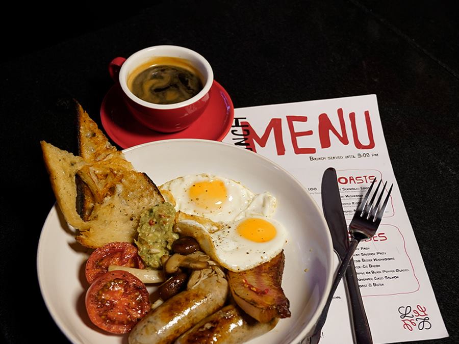 The English breakfast: eggs, sausage, tomato and hash