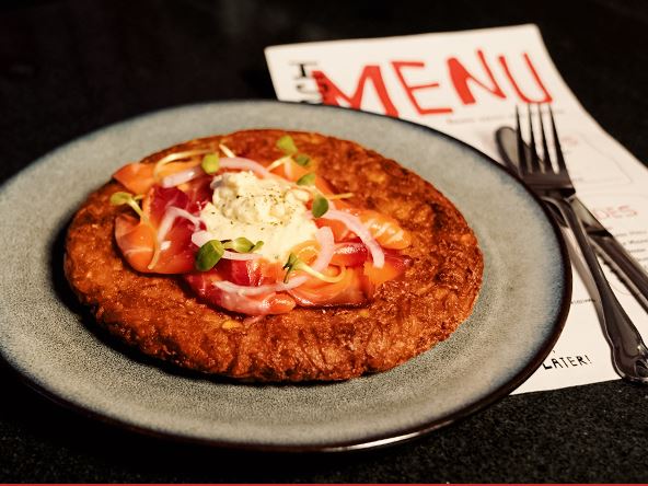 A crisp potato rosti topped with cured salmon and dill cream