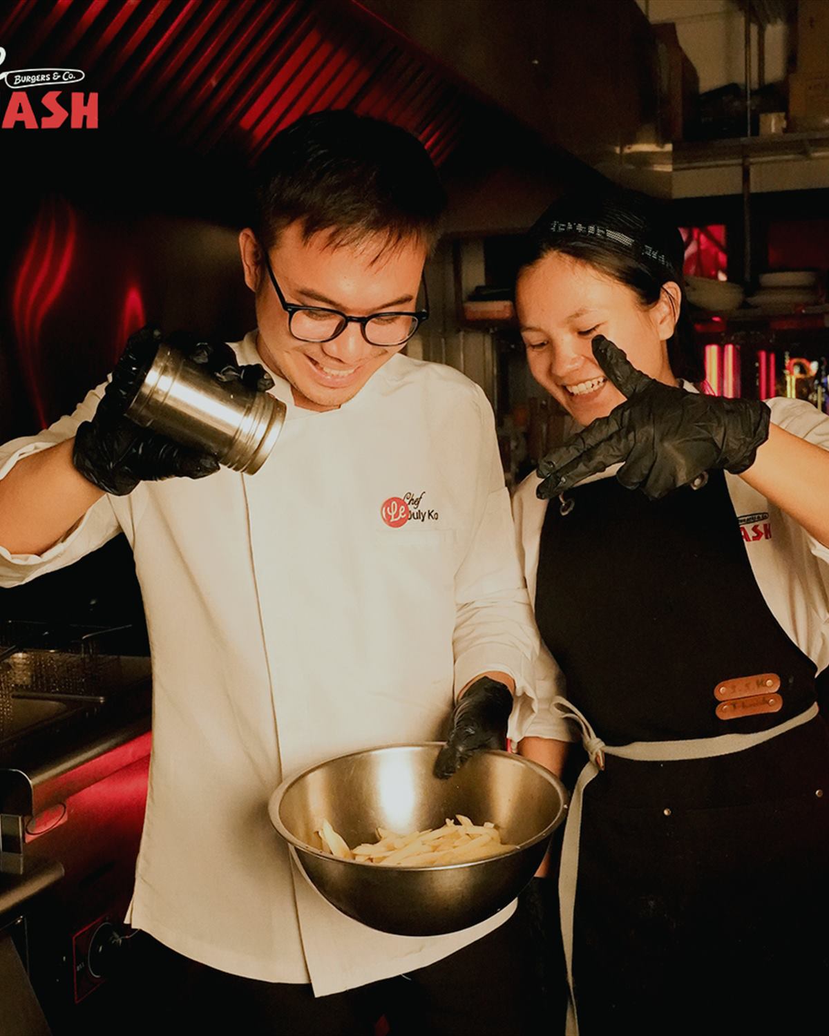 Two cooks working side by side