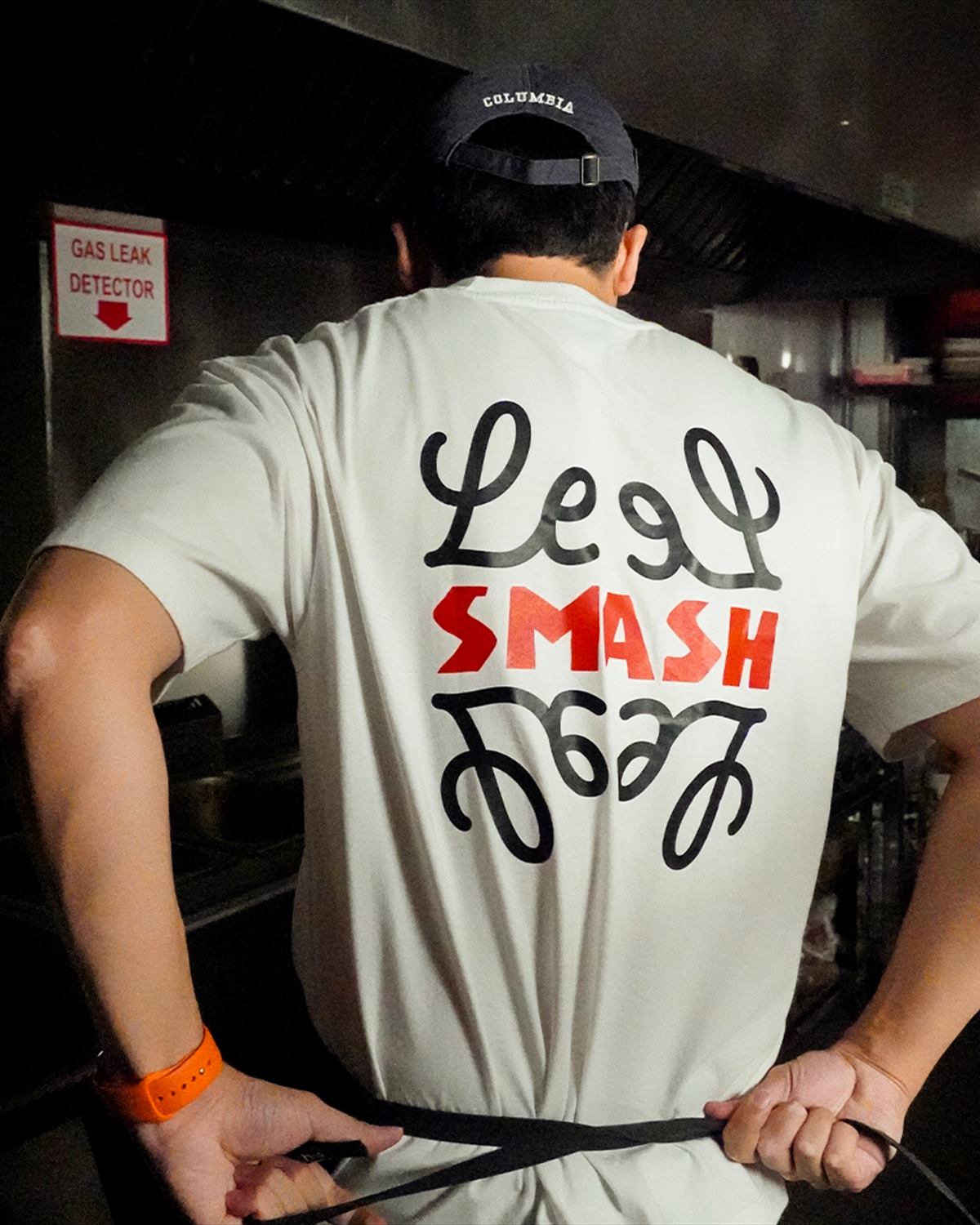 The hand-lettered Le SMASH shirt from behind