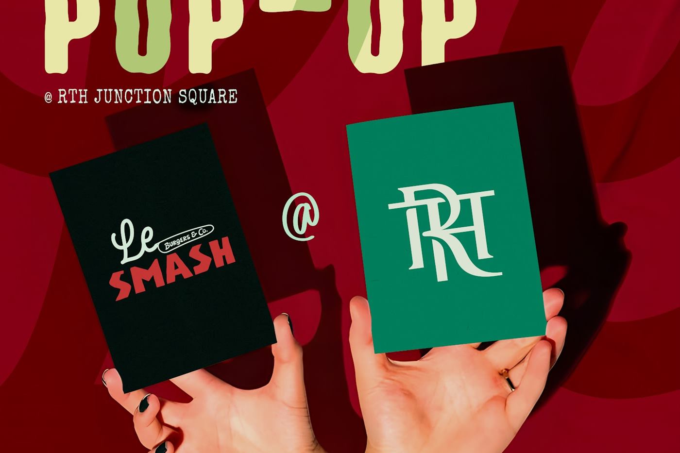 Two hands holding the Le SMASH and TRT cards for the pop-up