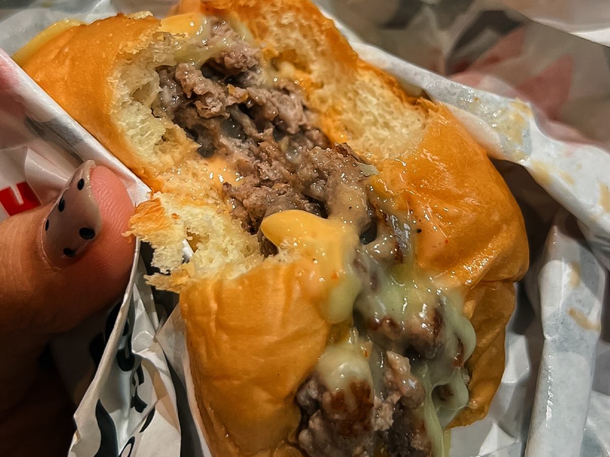 A burger opened out of its wrapper