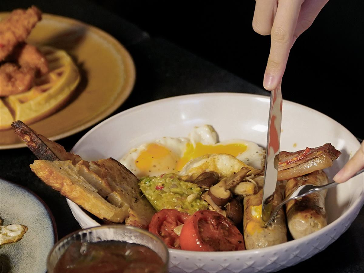 Waffles, eggs and salsa verde on one plate