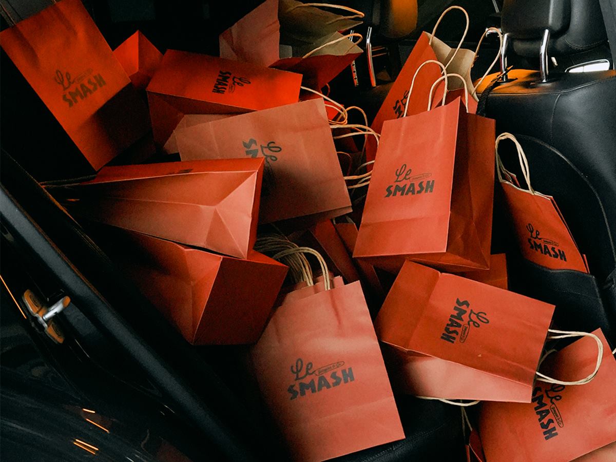A car boot full of Le SMASH takeaway bags