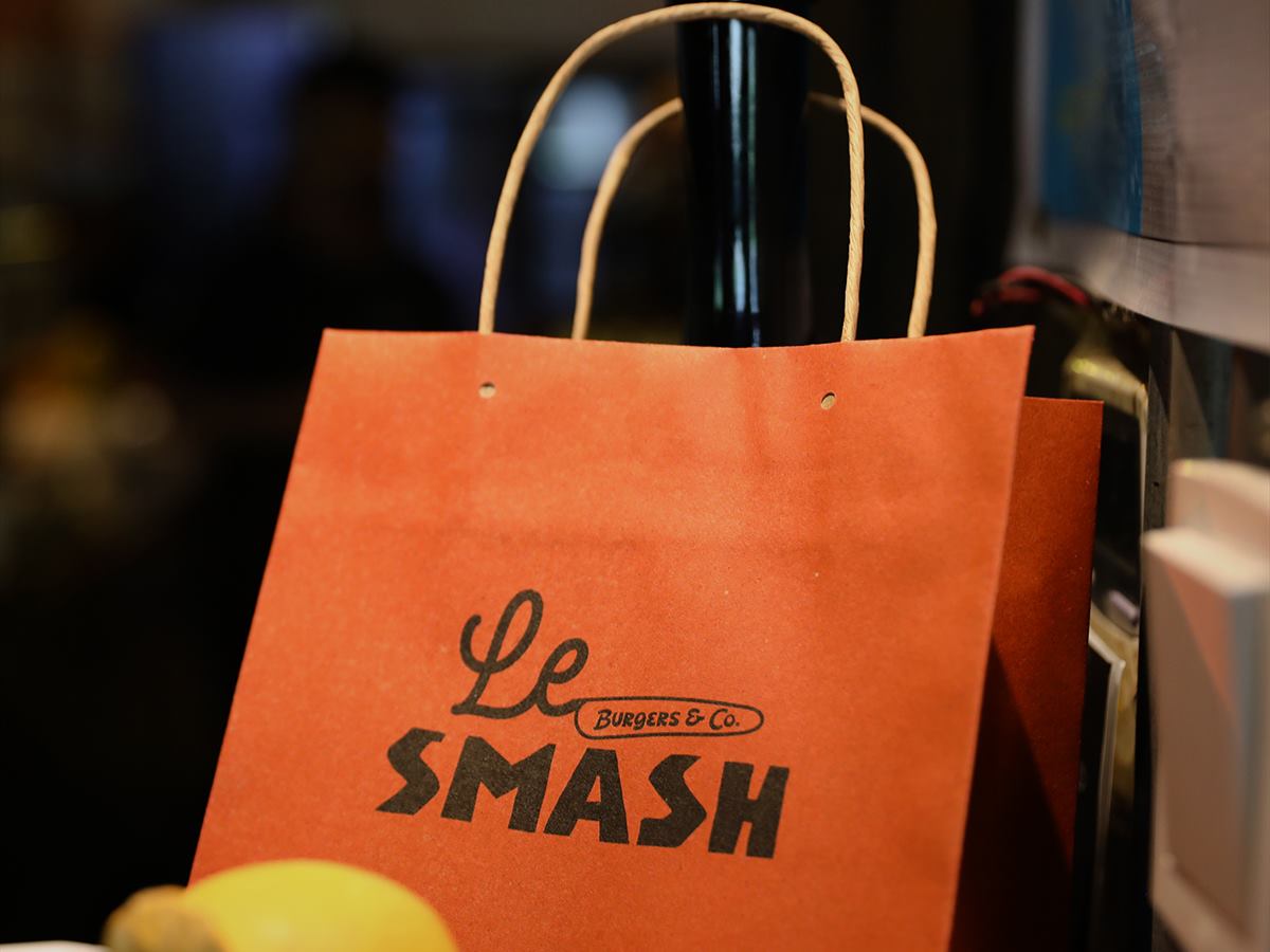 A Le SMASH takeaway bag on the counter